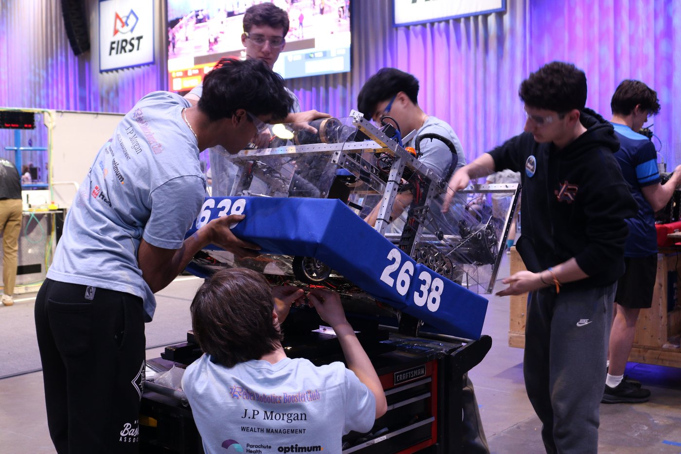 Team 2638 students working together on their competition robot.